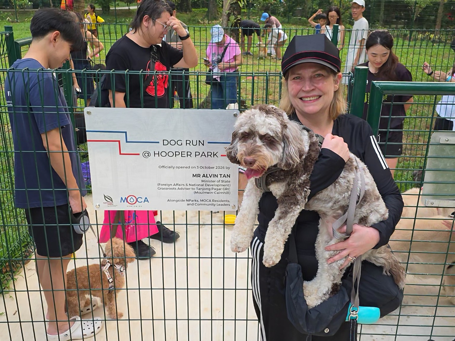 Victoria Watkins, UDO Head of Walkies, with Smeegles at the entrance to Dog Run @Hooper Park on opening day.